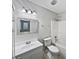Clean and well-lit bathroom with a combined shower and tub and a modern vanity at 8146 Whitaker Valley Blvd, Indianapolis, IN 46237
