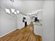 Open kitchen with modern white cabinets, stainless steel appliances, and hardwood floors at 8146 Whitaker Valley Blvd, Indianapolis, IN 46237
