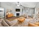 Bright living room with vaulted ceilings, a fireplace, neutral decor, and a cozy seating area at 8146 Whitaker Valley Blvd, Indianapolis, IN 46237