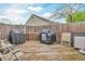 Cozy backyard deck area with barbecue grills and outdoor seating, great for outdoor cooking and relaxation at 8375 Eagles Nest Dr, Avon, IN 46123