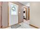 Warm entryway featuring wood-look floors and decorative leaded-glass front door at 8375 Eagles Nest Dr, Avon, IN 46123
