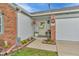 Inviting front entrance with decorative accents, plants, and a charming front door at 8375 Eagles Nest Dr, Avon, IN 46123