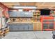 Organized garage featuring cabinets, shelves, and a workbench with ample storage space at 8375 Eagles Nest Dr, Avon, IN 46123