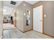 Bright hallway with wood-look flooring, leading to living area and featuring neutral paint at 8375 Eagles Nest Dr, Avon, IN 46123