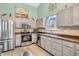 Updated kitchen with stainless steel appliances, ample counter space, and plenty of natural light at 8375 Eagles Nest Dr, Avon, IN 46123