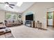 Cozy living room with plush seating, a modern fireplace, and large window at 8375 Eagles Nest Dr, Avon, IN 46123