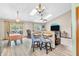 Open-concept living and dining areas filled with natural light from the windows and skylights at 8375 Eagles Nest Dr, Avon, IN 46123