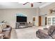 Comfortable living room with a large television, fireplace, and neutral carpeting at 8375 Eagles Nest Dr, Avon, IN 46123