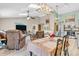 Bright and airy living space seamlessly integrates dining and kitchen areas for entertaining at 8375 Eagles Nest Dr, Avon, IN 46123