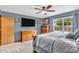 Comfortable main bedroom with an ensuite bathroom and view to the backyard at 8375 Eagles Nest Dr, Avon, IN 46123