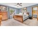 Inviting main bedroom with a ceiling fan and view to the backyard at 8375 Eagles Nest Dr, Avon, IN 46123