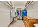 Spacious walk-in closet with ample hanging and shelving space, and a wooden dresser on a carpeted floor at 8375 Eagles Nest Dr, Avon, IN 46123