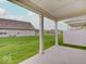 This patio looks out over a wide green lawn and neighboring homes at 8593 Hudson Way, Brownsburg, IN 46112