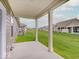 This patio looks out over a wide green lawn and neighboring homes at 8593 Hudson Way, Brownsburg, IN 46112