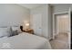 Comfortable bedroom with soft lighting and a glimpse into the ensuite bathroom at 8593 Hudson Way, Brownsburg, IN 46112