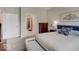 Spacious bedroom featuring a cozy bed, neutral walls, and a glimpse into the ensuite bathroom at 8593 Hudson Way, Brownsburg, IN 46112