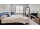 Comfortable bedroom showcasing a cozy bed, blue accents, and ample natural light at 8593 Hudson Way, Brownsburg, IN 46112