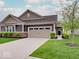 Charming single-Gathering home with a well-manicured lawn and an attached two-car garage at 8593 Hudson Way, Brownsburg, IN 46112