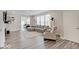 Bright living room with hardwood floors, large sectional sofa, and modern decor at 8593 Hudson Way, Brownsburg, IN 46112