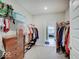 Spacious walk-in closet with organized storage solutions and a view into the bedroom at 8593 Hudson Way, Brownsburg, IN 46112