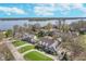 Scenic aerial view of home with lake in background, highlighting landscaping and neighborhood at 9719 Decatur Dr, Indianapolis, IN 46256