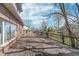 Wooden deck overlooks backyard with green grass and trees, offering a great outdoor space at 9719 Decatur Dr, Indianapolis, IN 46256