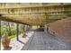 The undercarriage of a multi-level deck in the backyard with a view of the yard and landscaping at 9719 Decatur Dr, Indianapolis, IN 46256