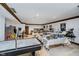 Finished basement with drop ceiling, recessed lights, and multiple gaming tables at 9719 Decatur Dr, Indianapolis, IN 46256