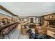 Spacious finished basement with a long bar, a comfortable living area, and a brick fireplace at 9719 Decatur Dr, Indianapolis, IN 46256