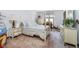 Comfortable bedroom with a four-poster bed, white furnishings, and natural light, offering a peaceful retreat at 9719 Decatur Dr, Indianapolis, IN 46256