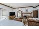 Spacious bedroom featuring a fireplace, TV, and an elegant, oversized mirror that enhances the room's natural light at 9719 Decatur Dr, Indianapolis, IN 46256