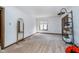 Empty bedroom with ample natural light, neutral carpet, and multiple doors, offering a versatile space for customization at 9719 Decatur Dr, Indianapolis, IN 46256