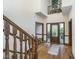 Two-story foyer with hardwood floors, grand staircase and front door at 9719 Decatur Dr, Indianapolis, IN 46256