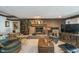 Relaxing living room with a brick fireplace, soft lighting, and cozy seating at 9719 Decatur Dr, Indianapolis, IN 46256