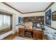 Home office featuring built-in shelving and window seat at 9719 Decatur Dr, Indianapolis, IN 46256