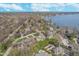 Aerial view showcasing the exclusive waterfront property with boat docks and lake access at 9719 Decatur Dr, Indianapolis, IN 46256