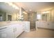 This bathroom features a glass enclosed shower, tile flooring, and a double vanity with ample storage at 9949 Stable Stone Ter, Fishers, IN 46040