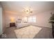 Spacious bedroom with plush carpet, bright windows, and neutral walls creating a peaceful retreat at 9949 Stable Stone Ter, Fishers, IN 46040