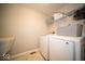 Convenient laundry room featuring modern appliances, tiled flooring, and built in shelving for storage at 9949 Stable Stone Ter, Fishers, IN 46040