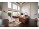 Bright and spacious living room with a tall ceiling, fireplace, and large windows at 9949 Stable Stone Ter, Fishers, IN 46040