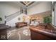 Expansive living room with hardwood floors, a fireplace, and a staircase leading upstairs at 9949 Stable Stone Ter, Fishers, IN 46040