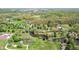 Expansive aerial view of sprawling property with ponds, mature trees, and multiple outbuildings at 10220 N Serenity Ln, Mooresville, IN 46158