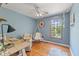 Bright bedroom with natural light, featuring a hanging chair, wood floors, and a spacious layout at 10220 N Serenity Ln, Mooresville, IN 46158