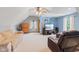 Cozy bonus room with vaulted ceilings, natural light, and comfortable seating for relaxation at 10220 N Serenity Ln, Mooresville, IN 46158