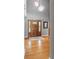 Welcoming entryway showcasing a chandelier, hardwood floors, and a decorative front door at 10220 N Serenity Ln, Mooresville, IN 46158