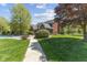 Beautiful home exterior with a lush lawn, charming landscaping, and a welcoming pathway at 10220 N Serenity Ln, Mooresville, IN 46158