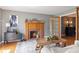 Inviting living room features a fireplace, wood floors, and stylish decor creating a warm ambiance at 10220 N Serenity Ln, Mooresville, IN 46158