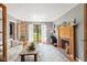 Inviting living room with fireplace, french doors, hardwood floors, and plenty of natural light at 10220 N Serenity Ln, Mooresville, IN 46158