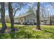 Neutral outbuilding with a single garage door, side door, and mature trees at 10220 N Serenity Ln, Mooresville, IN 46158