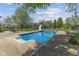 Inground pool with slide and concrete surround, perfect for summer fun and relaxation at 10220 N Serenity Ln, Mooresville, IN 46158